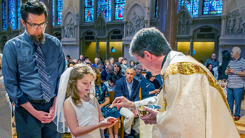 Indoor photo of a girl's First Communion